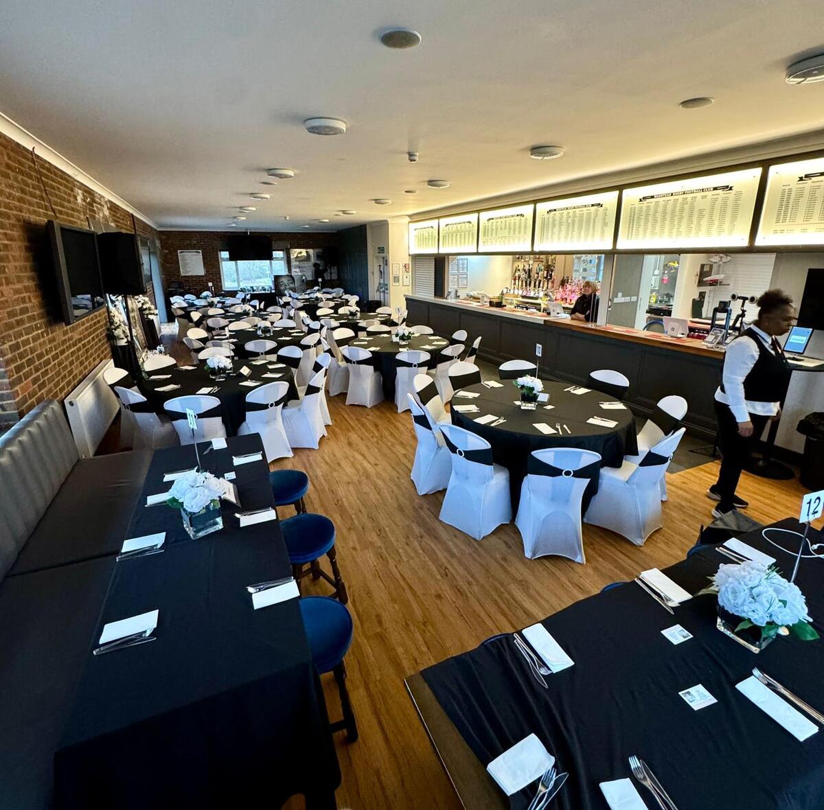 Formal dining with exposed brick wall